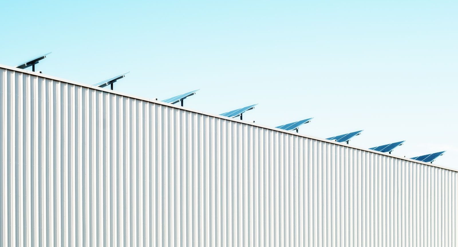 PV modules above the roof edge of an industrial building